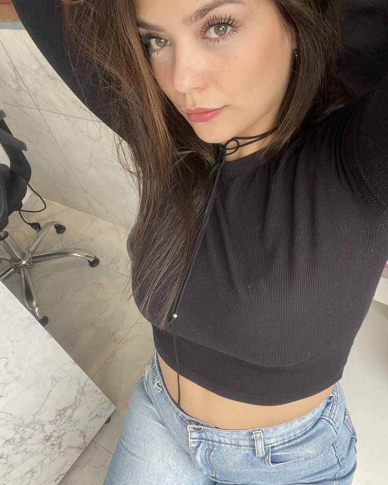 Olivia in a black top, close-up
